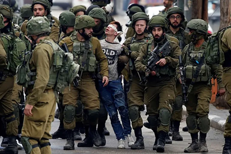 Palestinian Teen in Viral Image Charged Following Arrest in Hebron